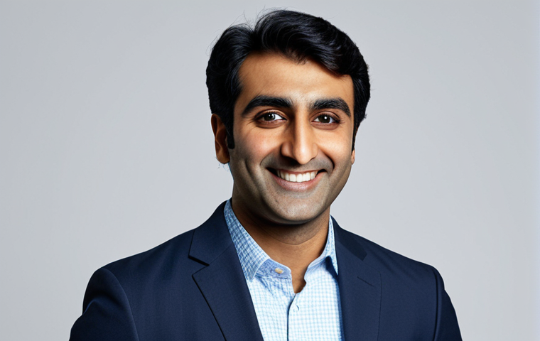 **

"Professional headshot of Kumail Nanjiani, appropriate attire, smiling confidently, modern studio lighting, safe for work, perfect anatomy, correct proportions, professional, modest, high-quality photography, well-formed hands, proper finger count, natural body proportions, fully clothed."

**